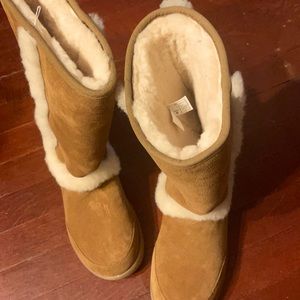 Sunburst tall ugg boots NEW never worn. They are an 8 but they run small (7-7.5)